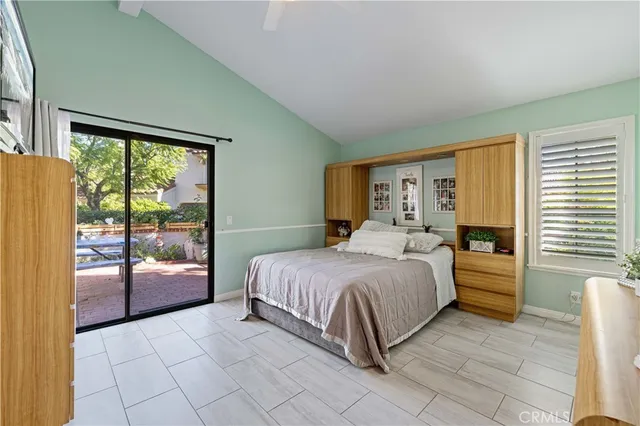 a spacious bathroom with a double vanity sink and a large mirror