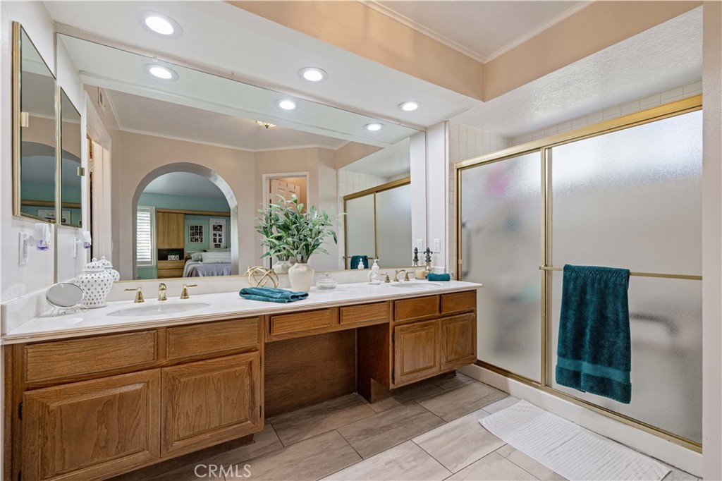 406 Country Club Drive Simi Valley, CA 93065 - Photo 43 of 56 a bathroom with a double vanity sink and mirror