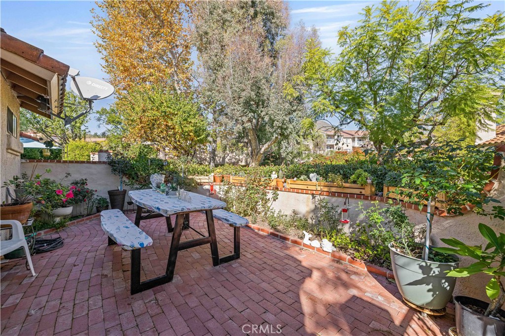 406 Country Club Drive Simi Valley, CA 93065 - Photo 47 of 56 a view of a lake with table and chairs and potted plants