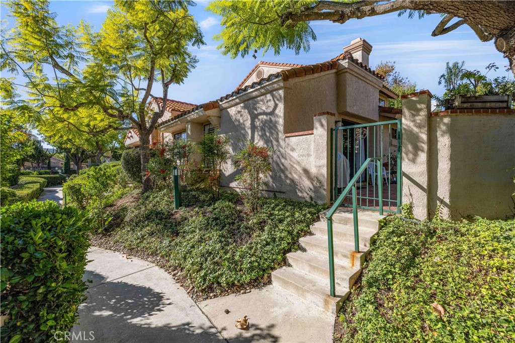 406 Country Club Drive Simi Valley, CA 93065 - Photo 54 of 56 a front view of a house with a yard