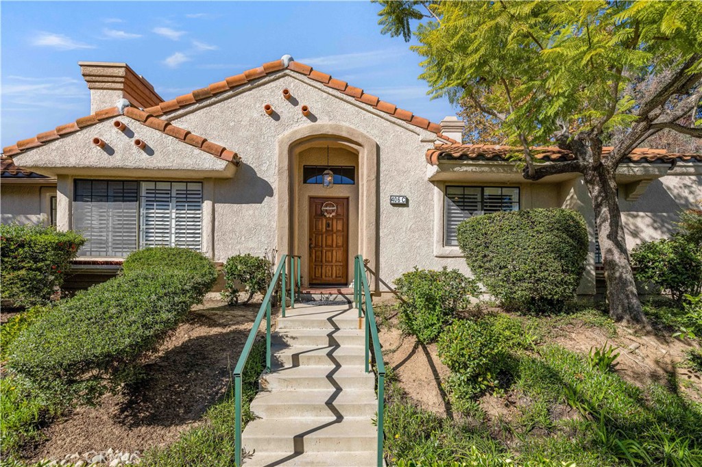 406 Country Club Drive Simi Valley, CA 93065 - Photo 55 of 56 a front view of a house with garden