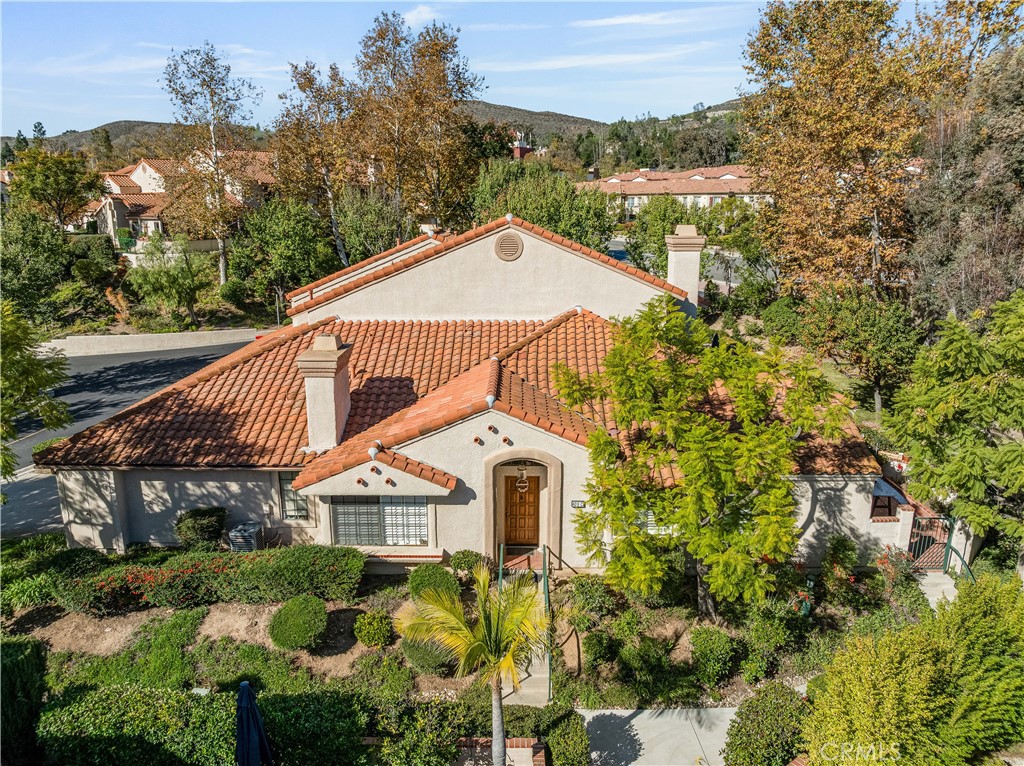 406 Country Club Drive Simi Valley, CA 93065 - Photo 10 of 56 a front view of a house with a yard and garage