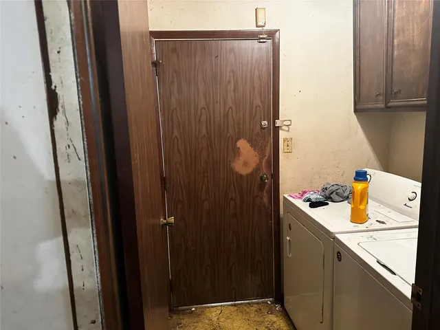 a bathroom with a sink and washing machine