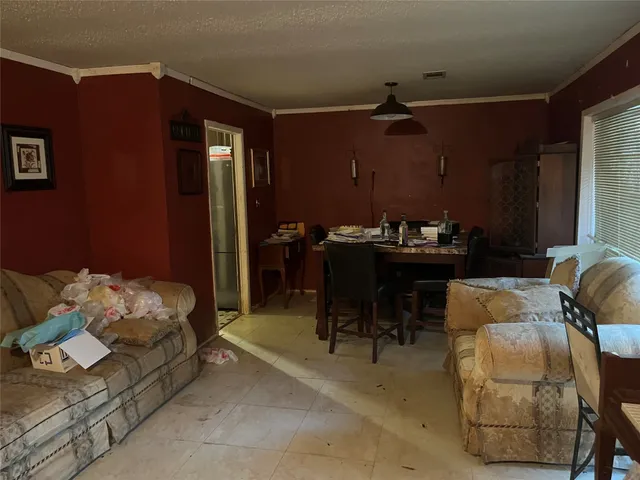 a bedroom with furniture and a chandelier