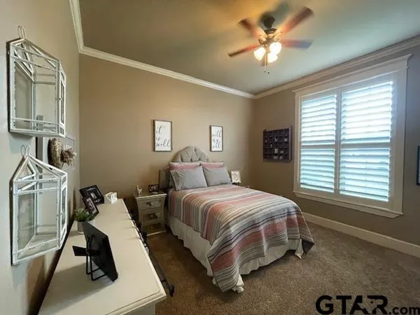 a bathroom with a granite countertop toilet and a sink