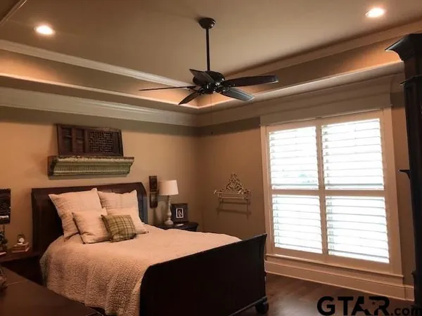 a bed room with a bed and a chandelier