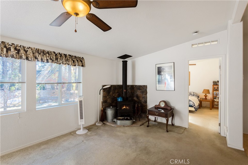 23700 Clement Way Idyllwild, CA 92549 - Photo 8 of 32 a living room with furniture and a chandelier