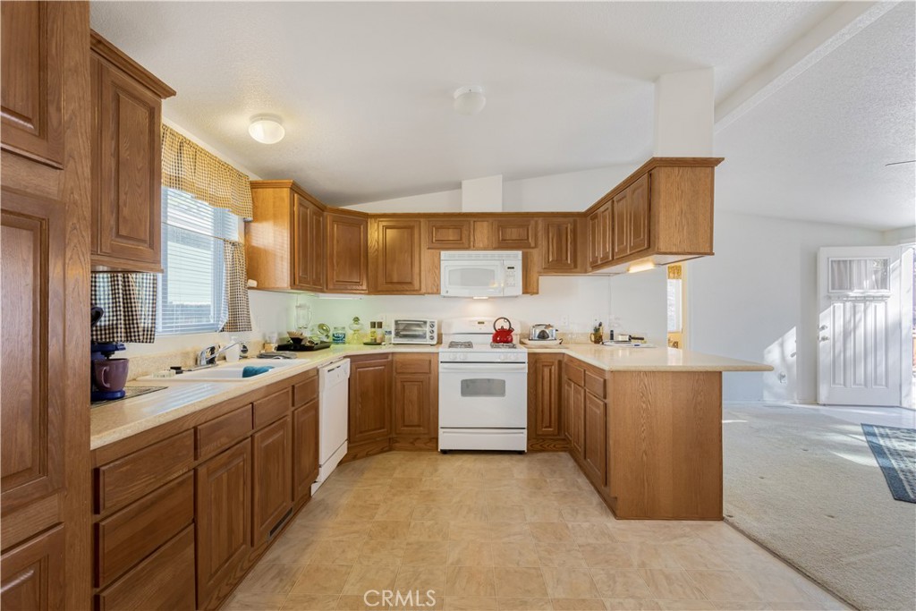 23700 Clement Way Idyllwild, CA 92549 - Photo 10 of 32 a kitchen with cabinets and window