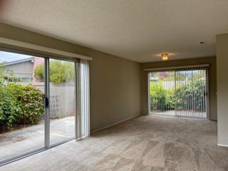 Undisclosed Address Aptos, CA 95003 - Photo 7 of 10 a view of an empty room with a sliding door