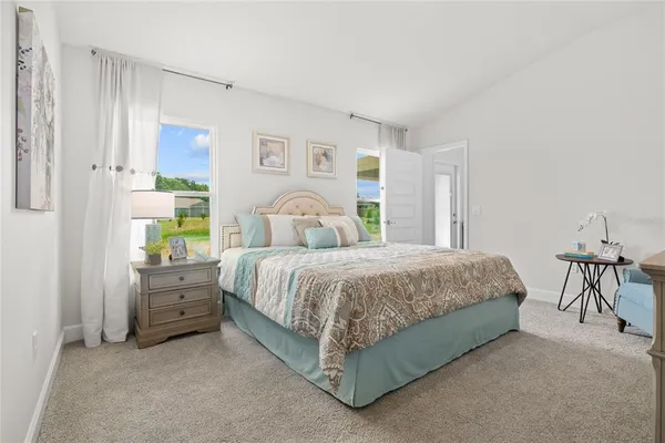 a bedroom with a bed and a table