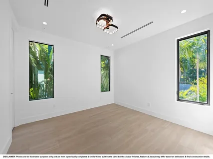 a kitchen with kitchen island granite countertop a sink cabinets and stainless steel appliances