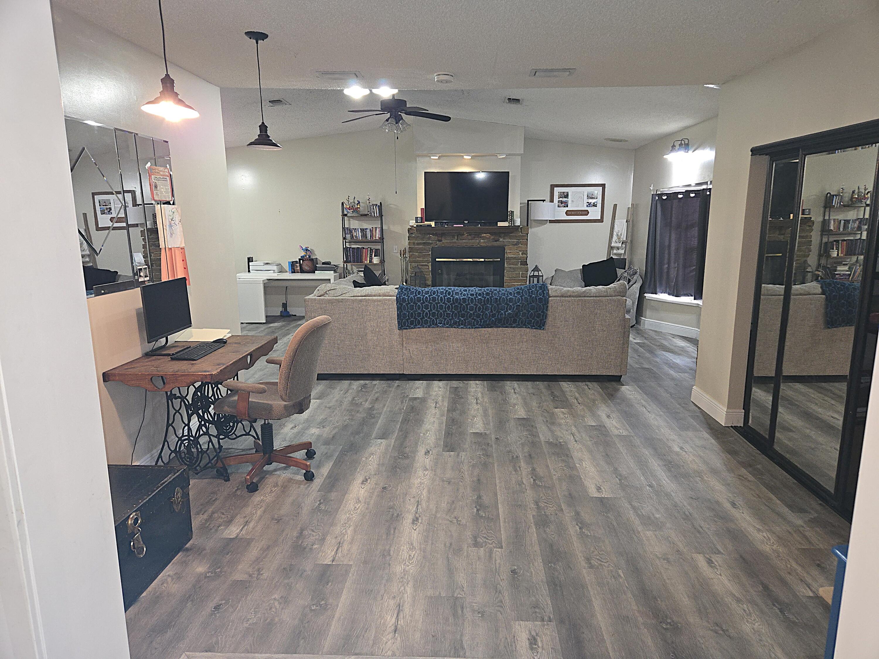 211 Northeast 3rd Terrace Williston, FL 32696 - Photo 14 of 46 a living room with furniture and a flat screen tv