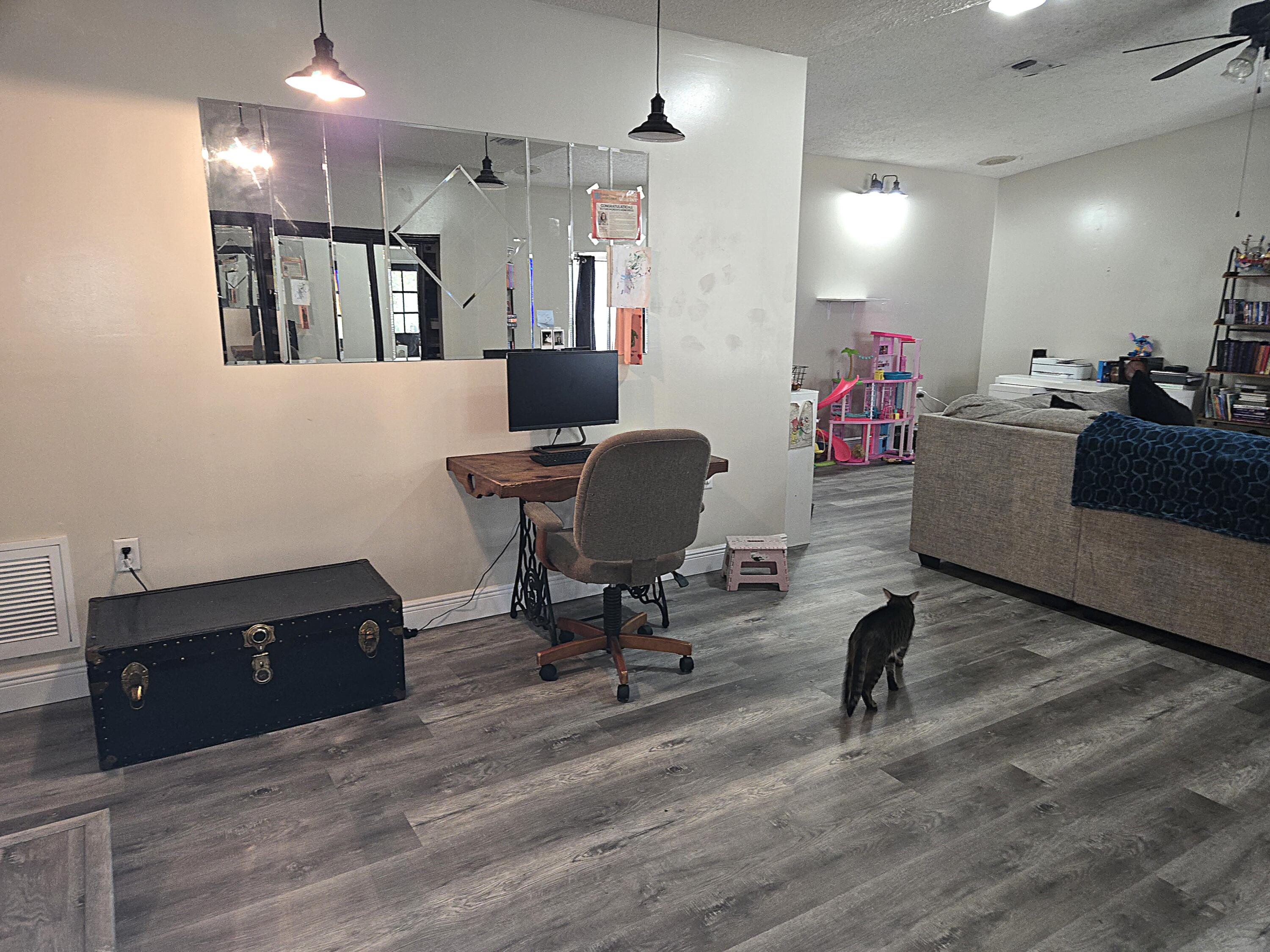211 Northeast 3rd Terrace Williston, FL 32696 - Photo 15 of 46 a living room with furniture and a wooden floor