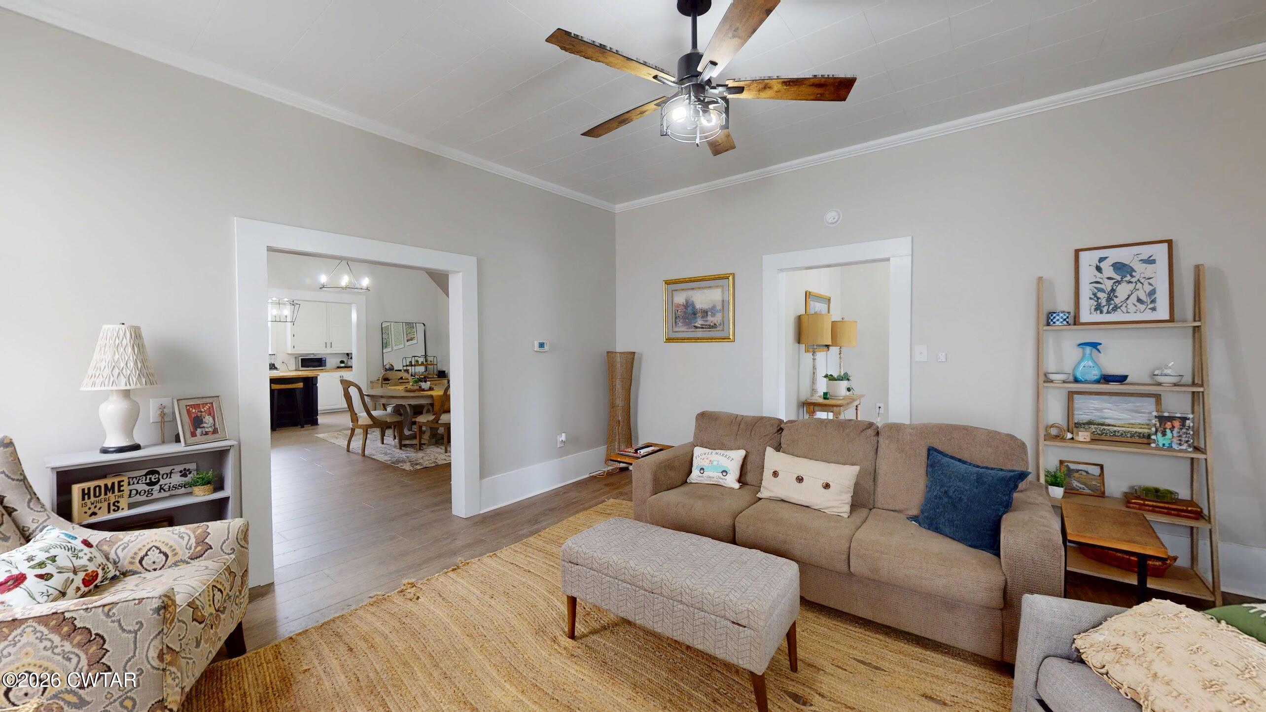 2800 Locust Grove Road Newbern, TN 38059 - Photo 10 of 46 a living room with furniture and a chandelier