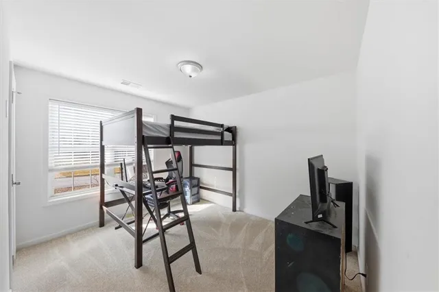 a view of a room with furniture and window