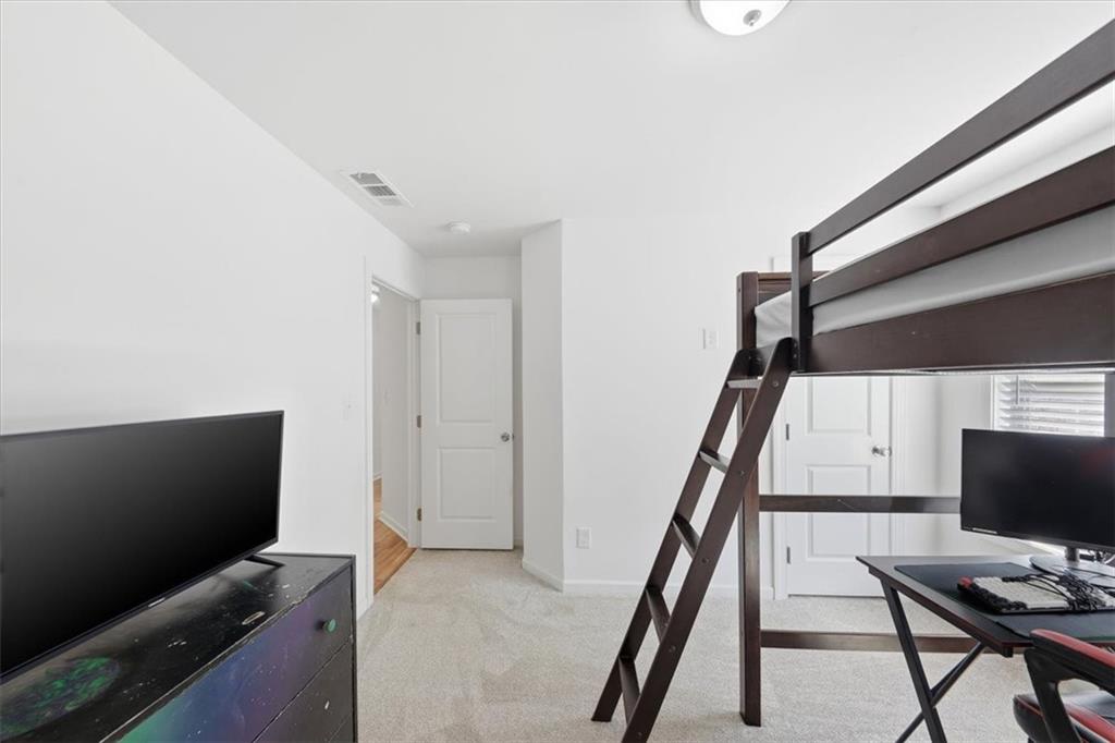 2769 Springfount Trail Northeast Lawrenceville, GA 30043 - Photo 25 of 52 a view of a workspace with furniture and a window