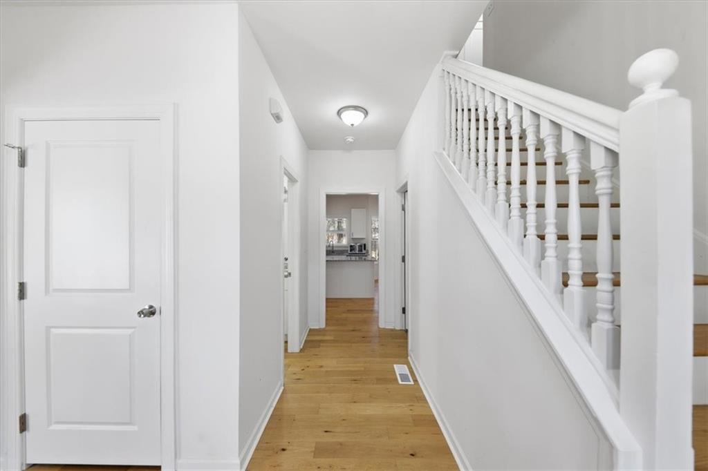 2769 Springfount Trail Northeast Lawrenceville, GA 30043 - Photo 5 of 52 a view of a hallway with wooden floor and staircase