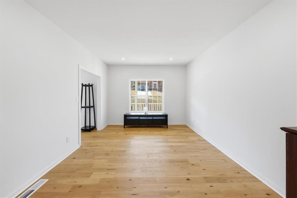 2769 Springfount Trail Northeast Lawrenceville, GA 30043 - Photo 7 of 52 an empty room with windows