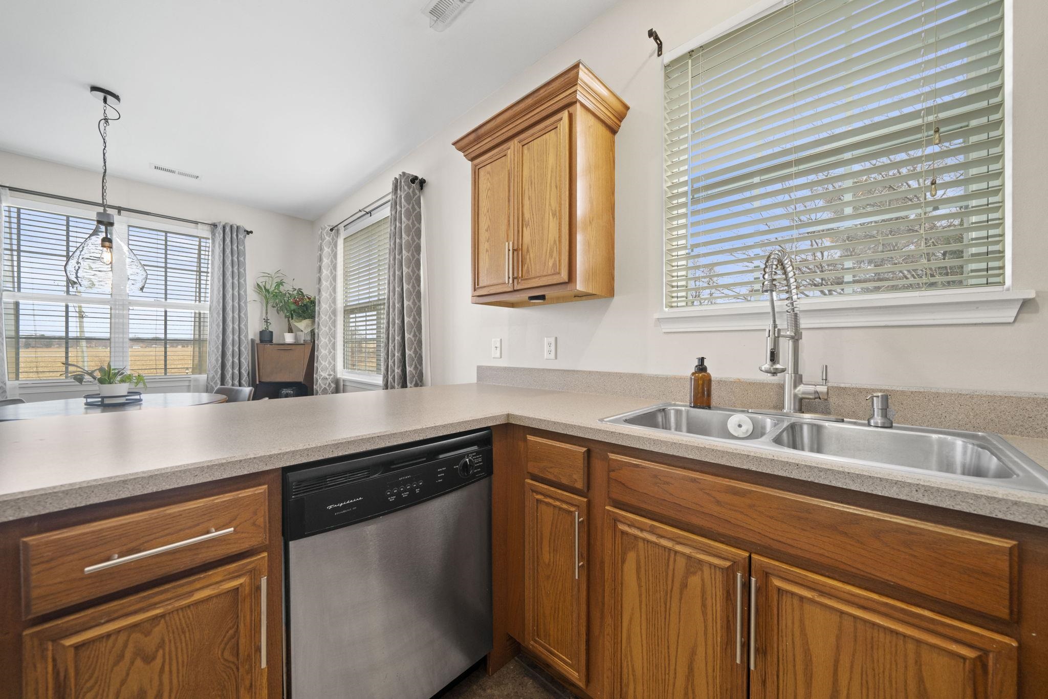 7621 Magnolia Trail Cherry Valley, IL 61016 - Photo 4 of 27 a kitchen with stainless steel appliances a sink stove and cabinets