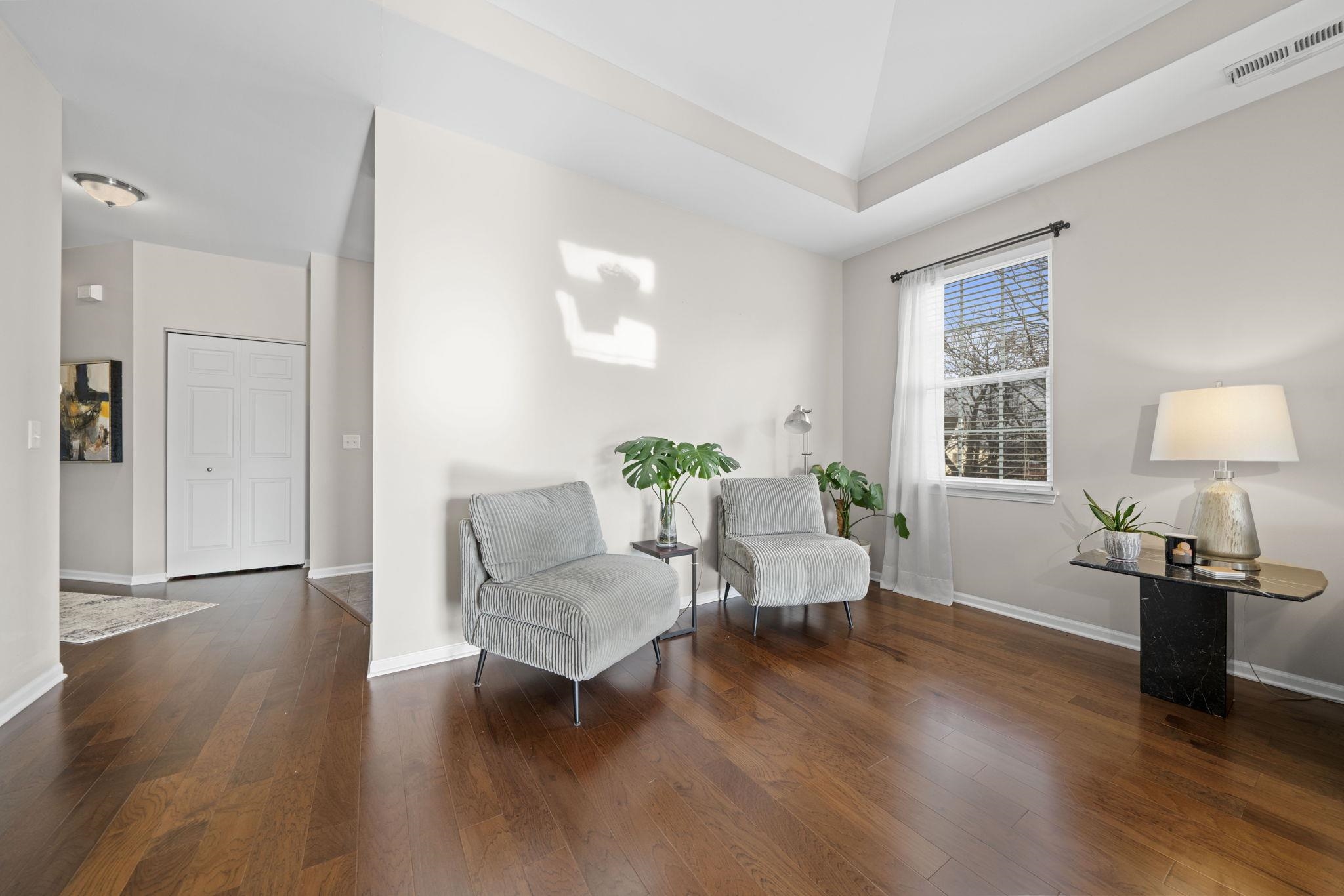 7621 Magnolia Trail Cherry Valley, IL 61016 - Photo 8 of 27 a living room with furniture and a wooden floor
