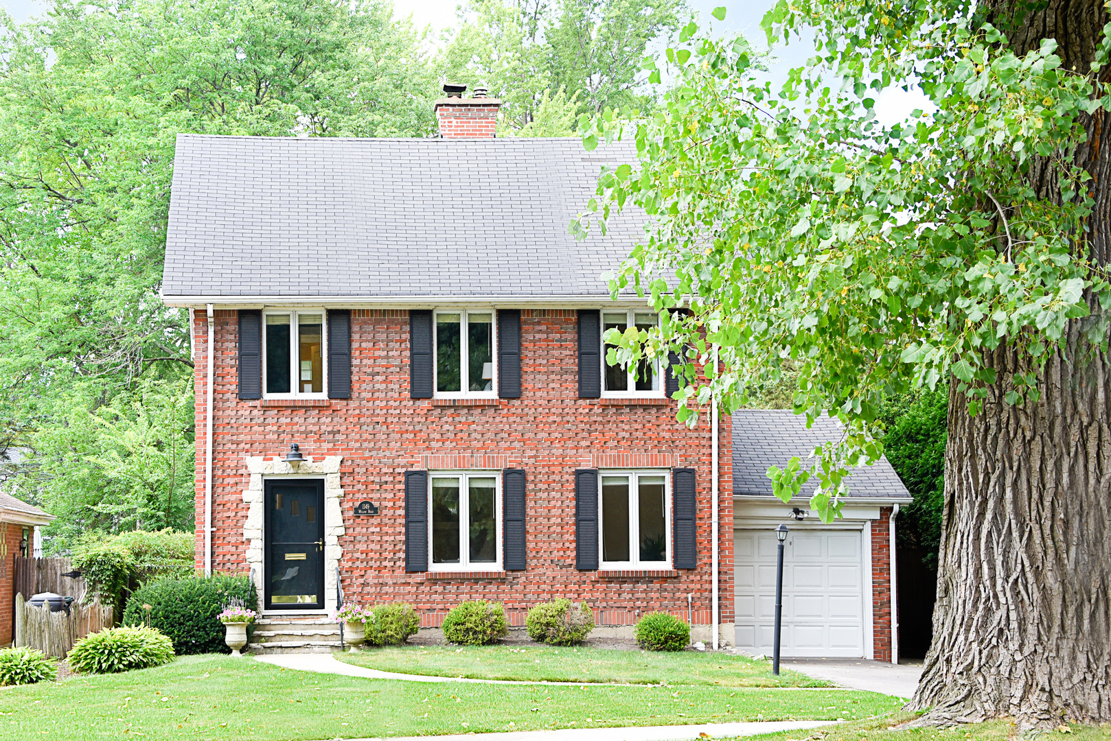 front view of a house with a yard