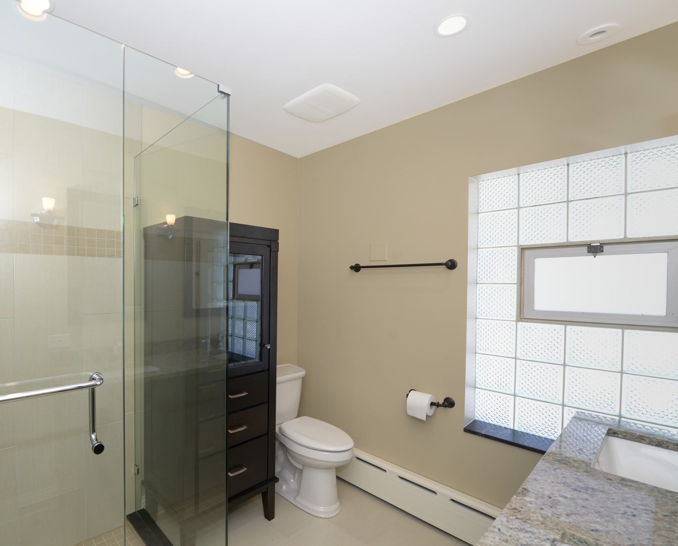 1149 Willow Road Winnetka, IL 60093 - Photo 19 of 37 a bathroom with a toilet a sink and shower