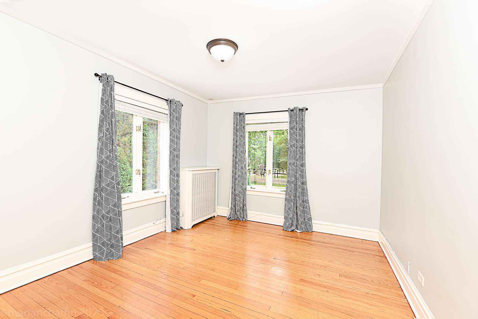 1149 Willow Road Winnetka, IL 60093 - Photo 22 of 37 a view of empty room with wooden floor and fan