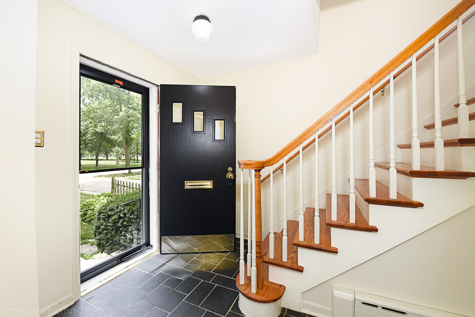 1149 Willow Road Winnetka, IL 60093 - Photo 4 of 37 a view of entryway with wooden floor and stairs