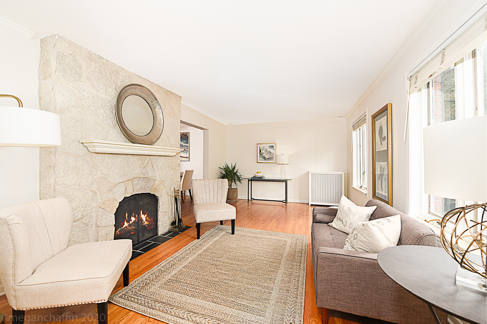 1149 Willow Road Winnetka, IL 60093 - Photo 6 of 37 a living room with furniture a fireplace and a table