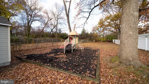 a view of a yard covered with snow in the background