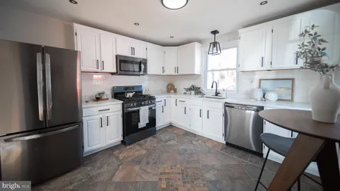 a view of entryway with livingroom and window
