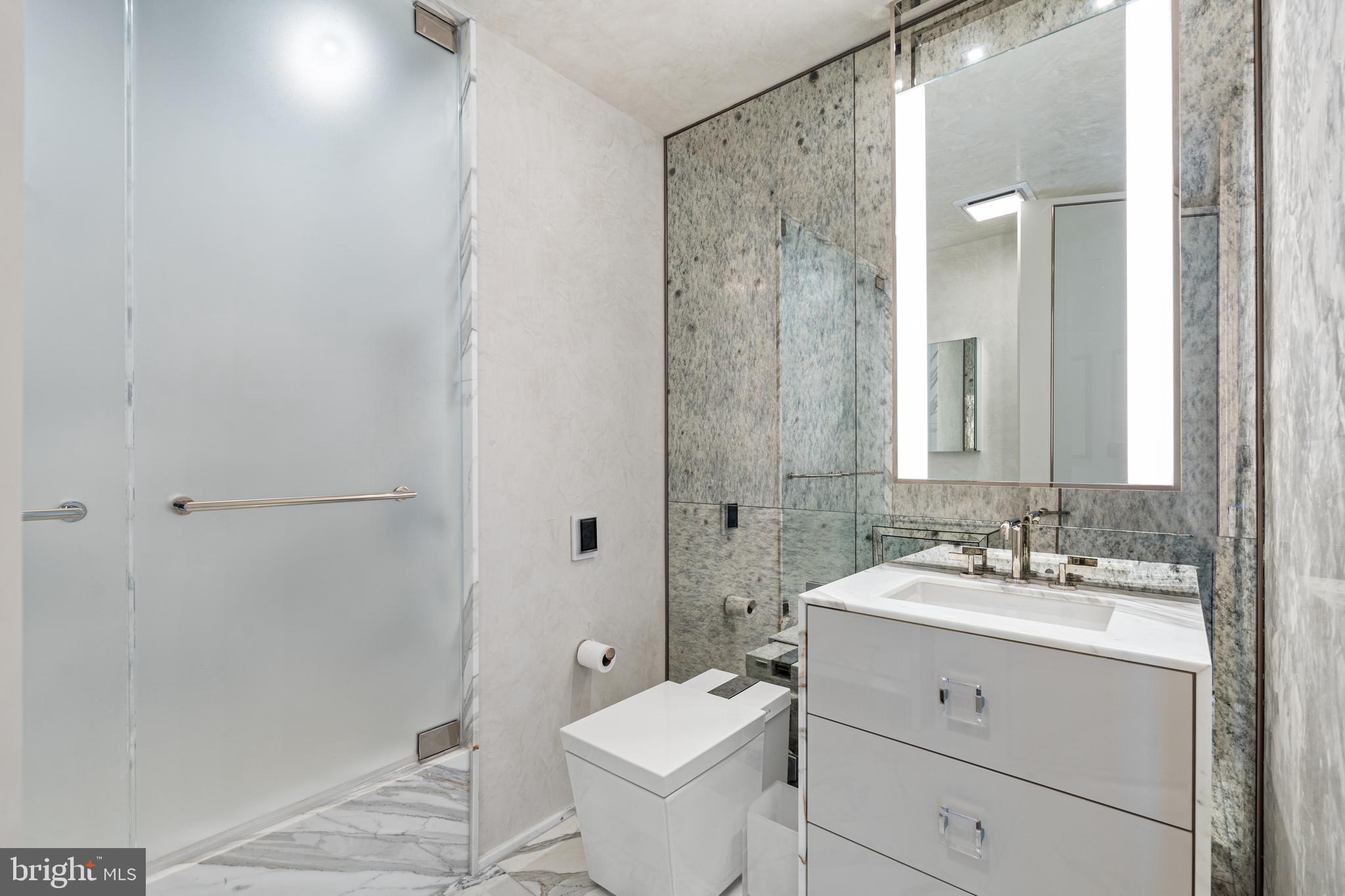 1111 24th Street Northwest, Unit 93 Washington, DC 20037 - Photo 20 of 26 a bathroom with a sink and a mirror