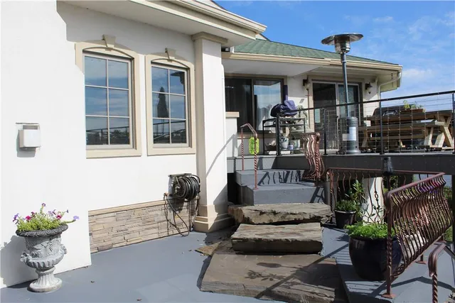 a terrace with outdoor seating and potted plants