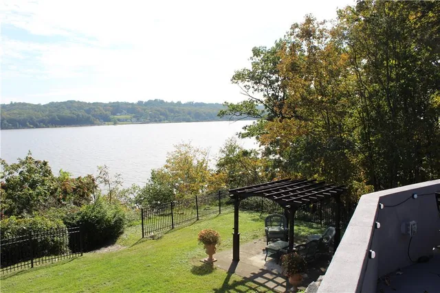 a view of a lake with houses in the back