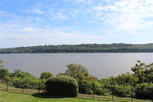 a view of a lake with houses in the back