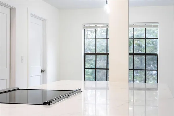 a view of a living room with windows