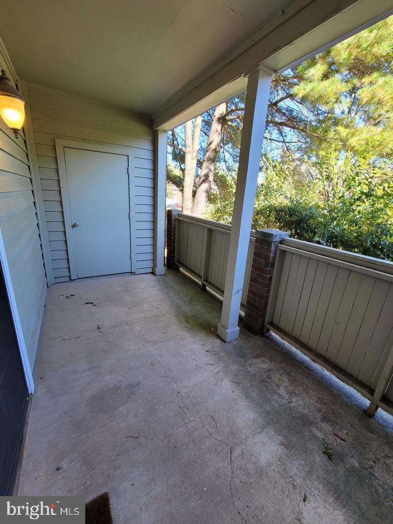 3908 Penderview Drive, Unit 608 Fairfax, VA 22033 - Photo 9 of 10 a view of a room with wooden floor and iron fence