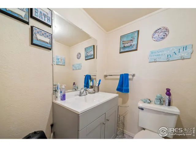 a bathroom with a sink mirror and vanity