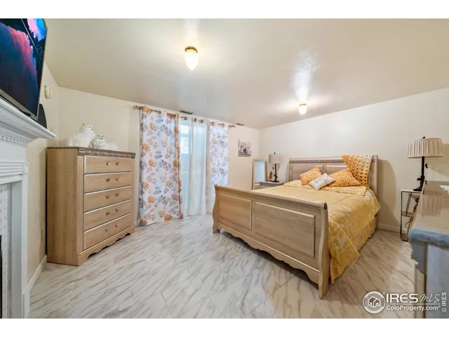 a bedroom with a bed and furniture