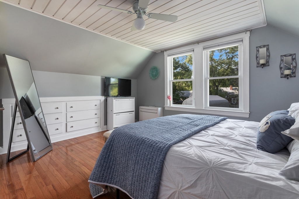 3 Webster Avenue Methuen, MA 01844 - Photo 17 of 34 a bedroom with a large bed and a dresser next to a window