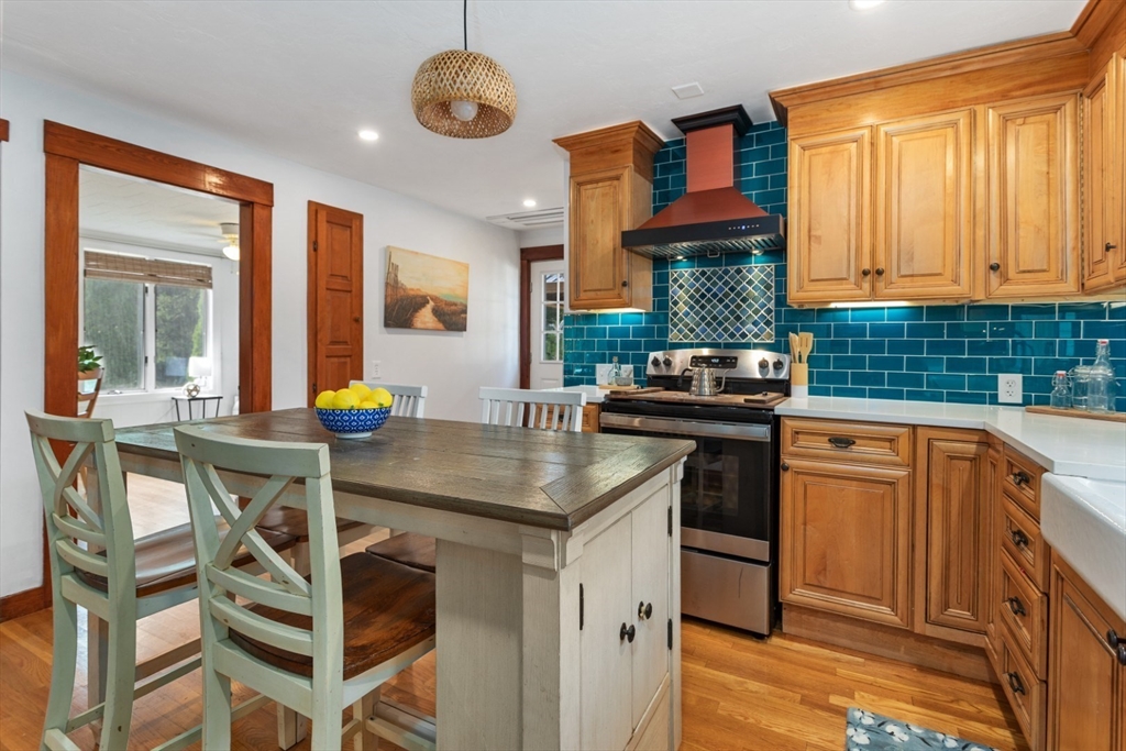 3 Webster Avenue Methuen, MA 01844 - Photo 2 of 34 a kitchen with a table chairs stove and cabinets