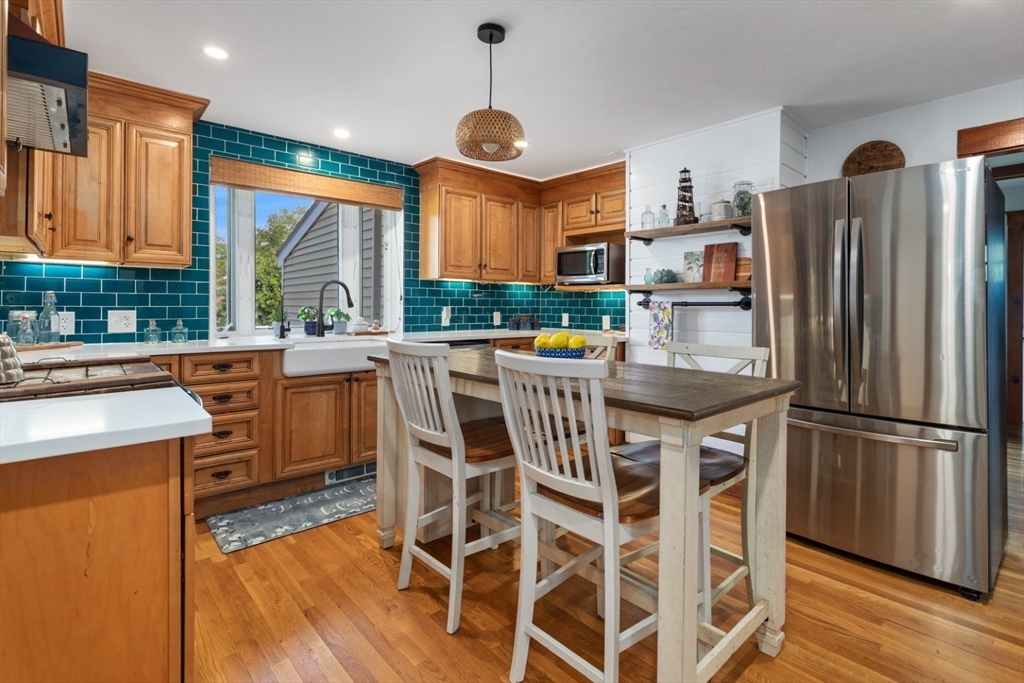 3 Webster Avenue Methuen, MA 01844 - Photo 3 of 34 a kitchen with stainless steel appliances a stove a refrigerator and a dining table