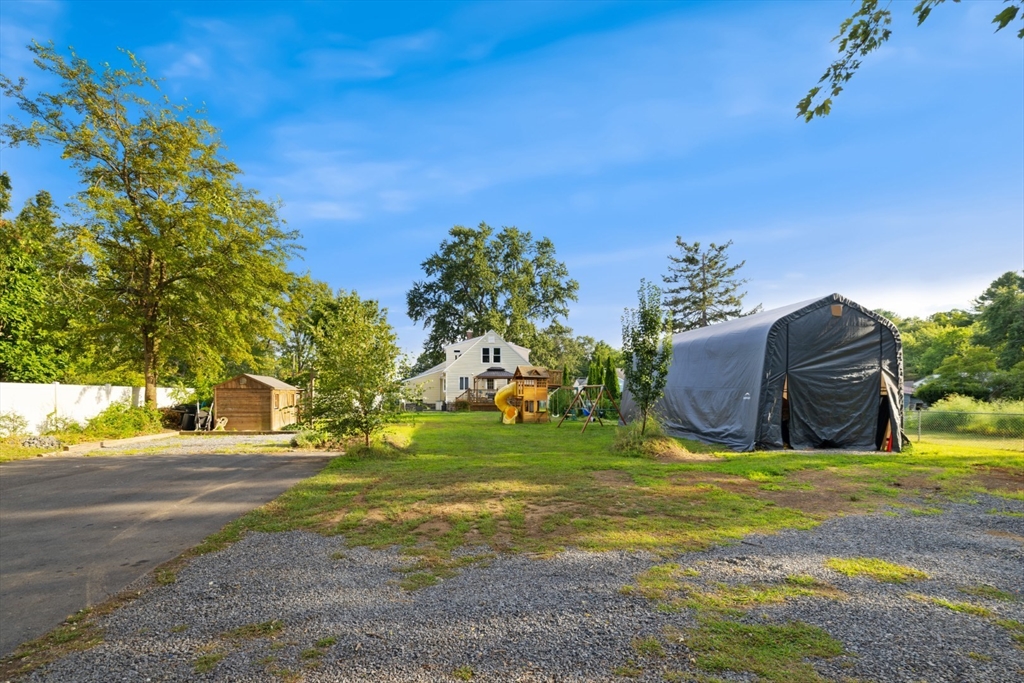 3 Webster Avenue Methuen, MA 01844 - Photo 31 of 34 a view of a big yard with potted plants and large tree