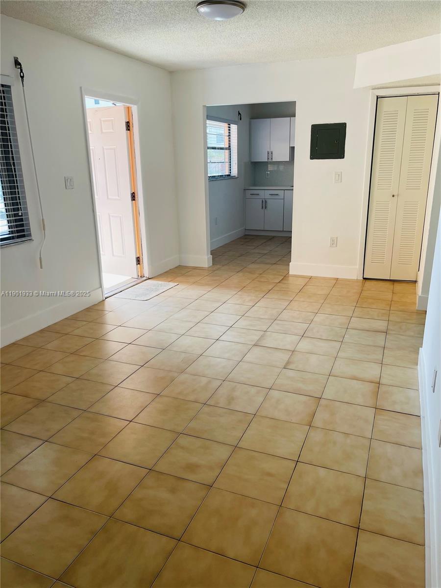 61 West 23rd Street, Unit 104 Hialeah, FL 33010 - Photo 13 of 17 an empty room with a bathroom