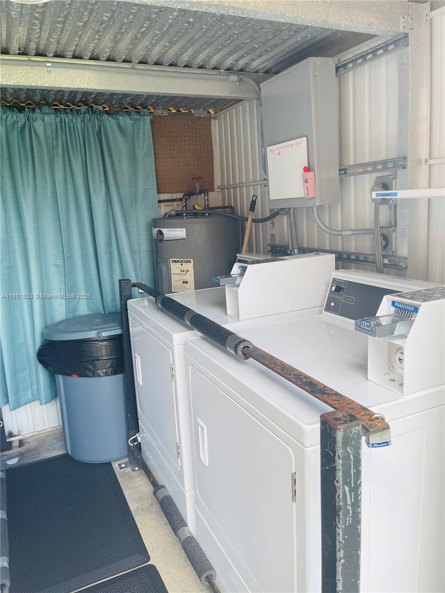 61 West 23rd Street, Unit 104 Hialeah, FL 33010 - Photo 17 of 17 a kitchen with a sink a stove and a refrigerator