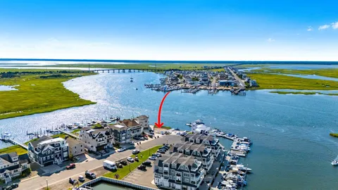 a roof deck with table and chairs a barbeque