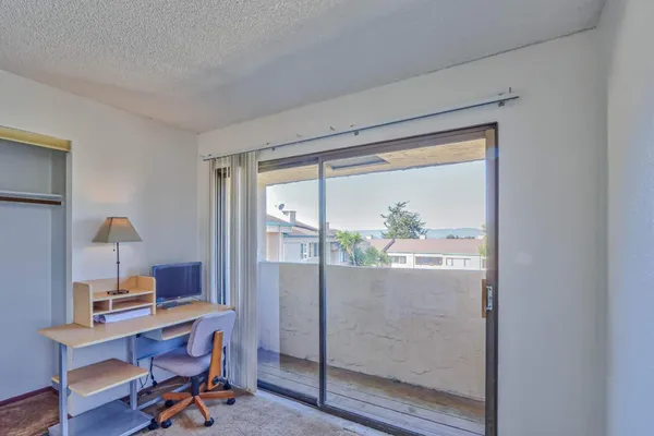 a workspace with furniture and a window
