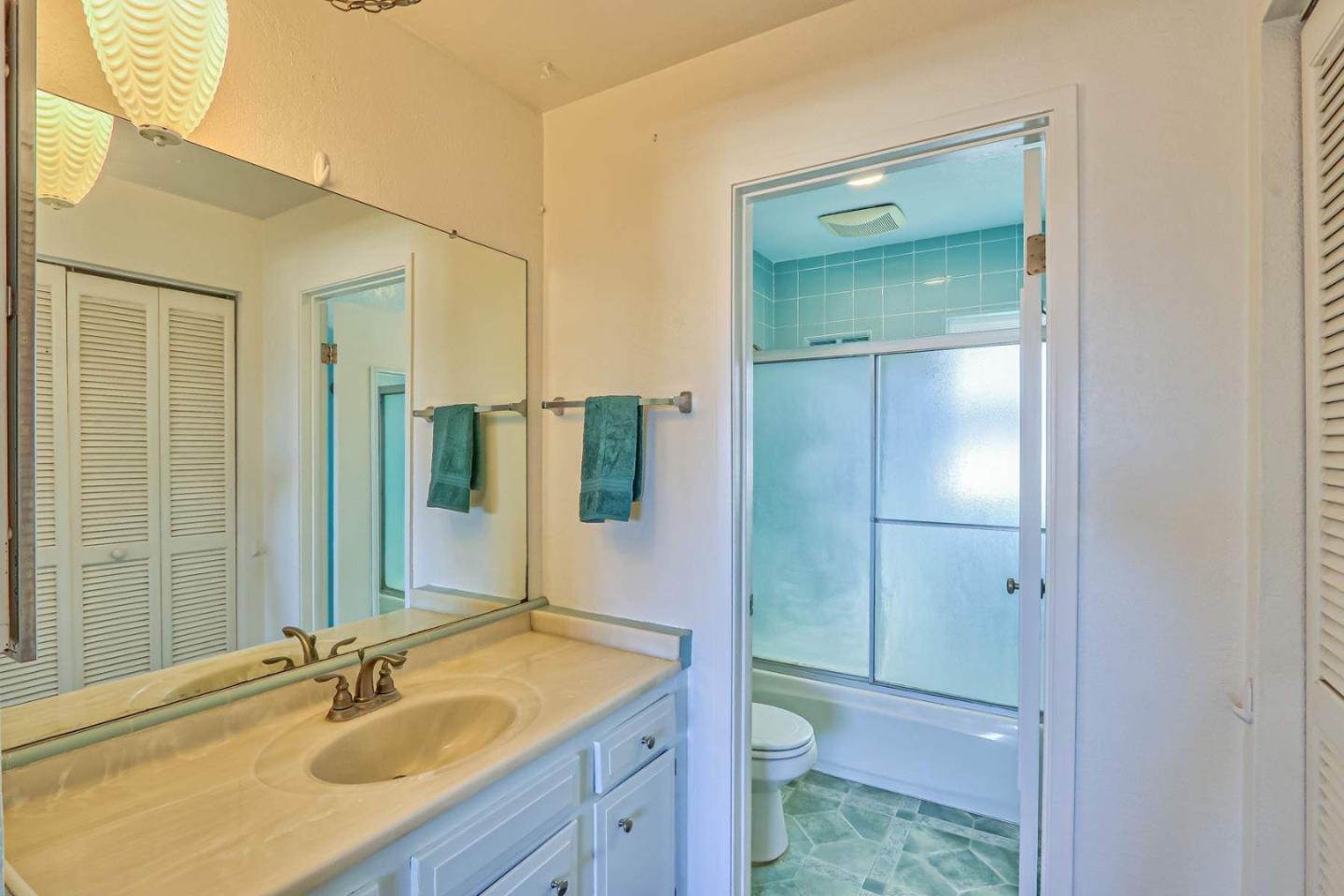 1212 Trinity Avenue Seaside, CA 93955 - Photo 10 of 16 a bathroom with a sink shower and a mirror