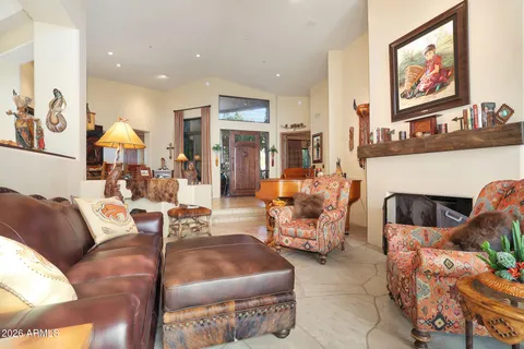 a room with furniture pool table and windows