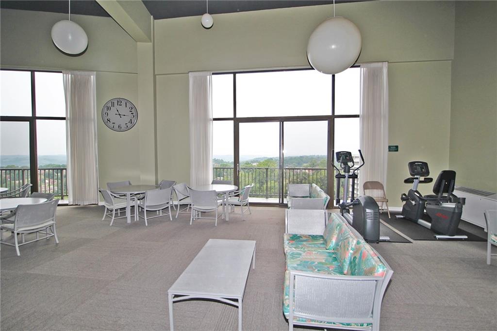 1150 Bower Hill Road, Unit 912A Pittsburgh, PA 15243 - Photo 11 of 39 a living room with furniture and a large window